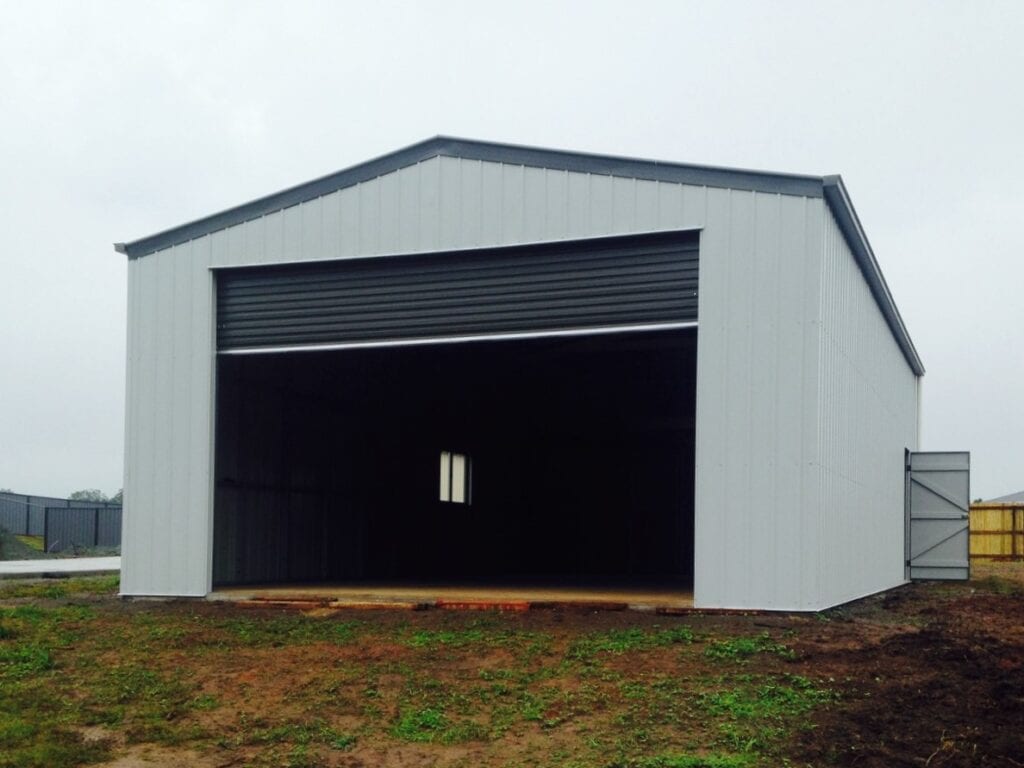 Gable roof shed with roller door = Colorbond "Shale Grey Matt"